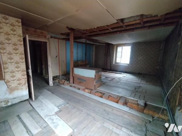 Immeuble mitoyen avec garages d'environ 250 m²