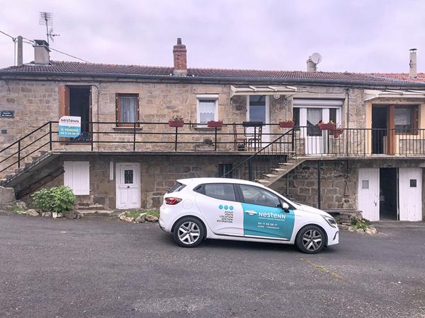 Ensemble de 3 logements avec dépendances, garage et terrain dans centre ville de Lapte