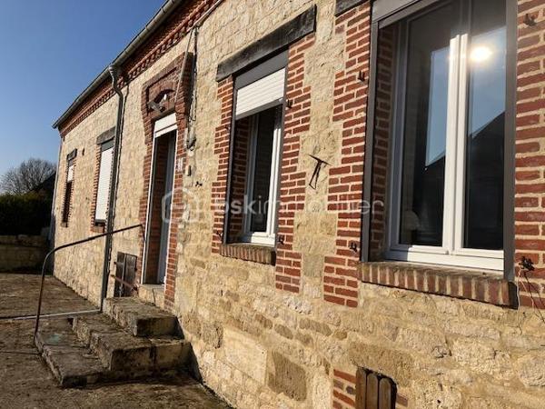 En Exclusivité avec votre agent immobilier Sylvain ORFANI du réseau BSK Immobilier, une maison de 130 m² située dans la charmante commune de Leuze dans l'Aisne.
Ce bien immobilier, niché au cœur d'un village typique de la Thiérache, se divise en deux parties distinctes. 
La première partie de la maison est en grande partie rénovée. Il comprend un vaste salon de 42 m², quatre chambres spacieuses dont deux au rez-de-chaussée et deux à l'étage, avec des surfaces comprises entre 11 et 14 m². La cuisine équipée a un style contemporain. Elle s'accompagne d'une salle de bain également mise au goût du jour. Au sol dans le salon et une chambre il y a un beau carrelage d'époque dans un état impeccable. 
Les travaux de finition à prévoir sont le revêtement de sol au 1er étage et salle de bain et peindre les murs. 
La seconde partie, indépendante, offre une surface de 47 m² (en dehors des 140 m2 de surface habitable )avec une entrée individuelle, idéale pour créer un logement autonome ou pour être rattachée à la partie principale en fonction des projets des futurs propriétaires. Cette seconde partie nécessite une rénovation complète, offrant un réel potentiel pour personnaliser cet espace unique. 

Il y a également un grand garage pour faire un atelier ou lieu de réception en été. 
..................
Exclusively with your real estate agent Sylvain ORFANI of the BSK Immobilier network, a 130 m² house located in the charming town of Leuze in the Aisne department.

This property, nestled in the heart of a typical Thiérache village, is divided into two distinct sections.

The first section of the house is largely renovated. It includes a spacious 42 m² living room, four large bedrooms (two on the ground floor and two upstairs) ranging in size from 11 to 14 m². The fitted kitchen has a contemporary style. It is complemented by a bathroom that has also been updated. The living room and one bedroom feature beautiful period tiles in impeccable condition.

The finishing work required includes flooring on the first floor and in the bathroom, and painting the walls. The second, independent section offers 47 m² of space (in addition to the 140 m² of living space) with its own entrance, ideal for creating a self-contained apartment or for connecting to the main house, depending on the future owners' plans. This second section requires complete renovation, offering real potential for personalizing this unique space.

There is also a large garage suitable for use as a workshop or summer reception area.