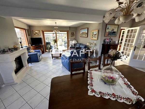 Maison pleine de cachet avec spacieuse véranda.