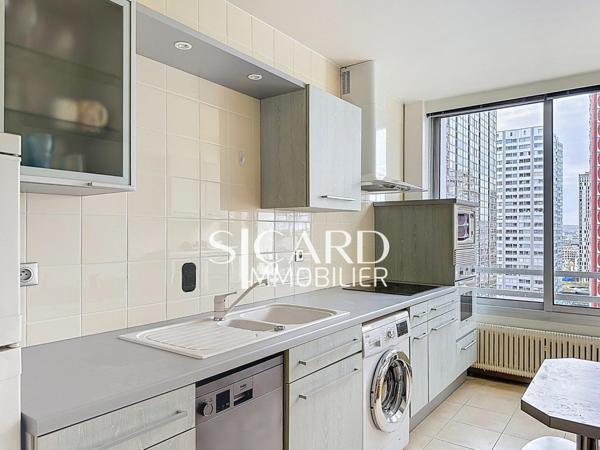 Appartement rénové, étage élevé, vue Seine - Paris 15