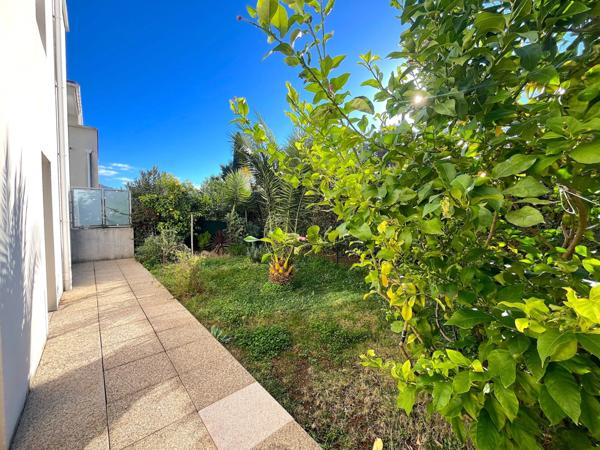 Appartement 3 pièces avec terrasse, jardin et deux places de parking