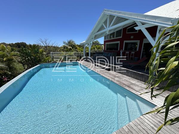 Saint-François (97118) Villa d'architecte idéale golfeurs avec 3 chambres + bureau, piscine et terrain de 1750m².