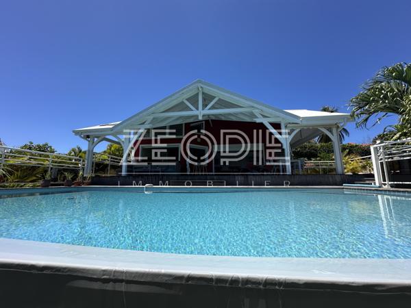 Saint-François (97118) Villa d'architecte idéale golfeurs avec 3 chambres + bureau, piscine et terrain de 1750m².