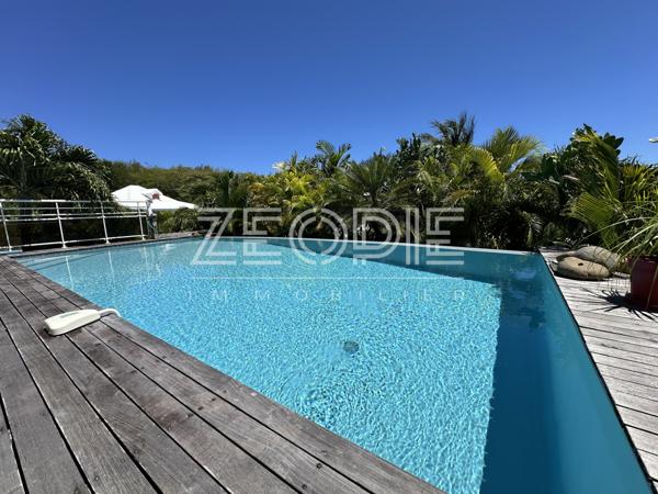 Saint-François (97118) Villa d'architecte idéale golfeurs avec 3 chambres + bureau, piscine et terrain de 1750m².