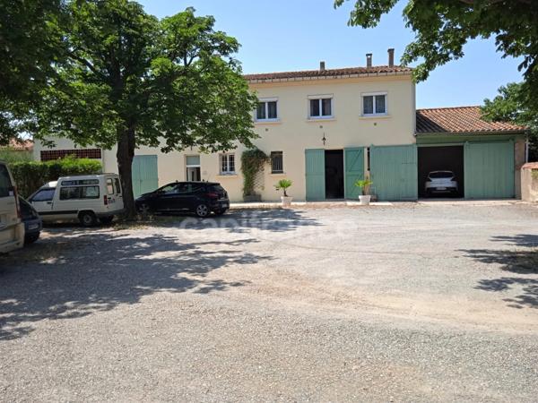 SOMPTUEUX ENSEMBLE IMMOBILIER AVECPOTENTIELEXCEPTIONNEL ET SON TERRAIN CONSTRUCTIBLE.