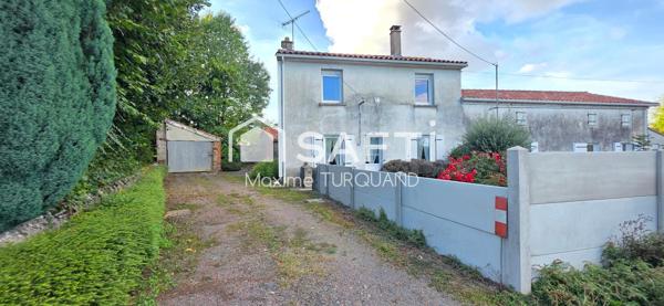 Ensemble immobilier comprenant 2 logements dont 1 loué + terrains + dépendances.