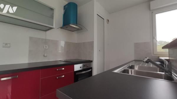 Appartement T2 de 46 m² avec balcon, cave et place de parking.