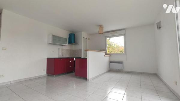 Appartement T2 de 46 m² avec balcon, cave et place de parking.