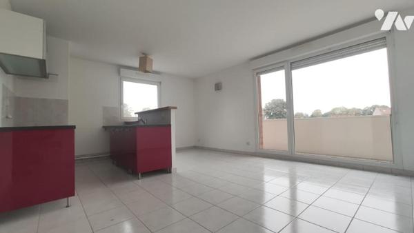 Appartement T2 de 46 m² avec balcon, cave et place de parking.