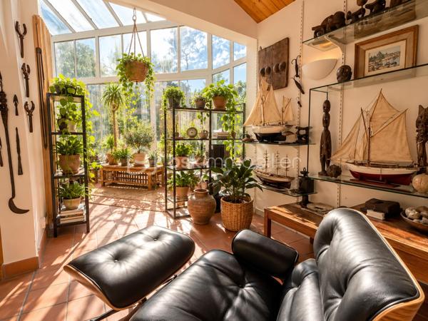 EN EXCLUSIVITE, dans un environnement résidentiel privilégié de Challans, découvrez cette très belle propriété de 1991, nichée au cœur d'un magnifique parc arboré et entièrement clos de 6 330 m².

Développant environ 200 m² de plain-pied et offrant 5  chambres, cette maison séduit par ses volumes généreux, la qualité de ses matériaux et une distribution particulièrement bien pensée pour la vie de famille.

L'espace de vie accueille une cuisine aménagée et équipée donnant sur la salle à manger, prolongée par un salon chaleureux agrémenté d'une superbe cheminée ouverte. Une véranda et une terrasse exposée sud-ouest invitent à profiter pleinement du jardin et de son environnement verdoyant.

L'espace nuit accueille une spacieuse suite parentale avec de nombreux dressings, une salle de bains avec double vasque.

Quatre autres chambres complètent cet ensemble, desservies par un couloir baigné de lumière grâce à ses grandes baies vitrées. Une seconde salle d'eau, et des WC indépendants viennent parfaire cet espace.

Côté pratique, la propriété dispose de deux garages avec portes motorisées et accès direct à la maison, ainsi que d'une buanderie.

À l'extérieur, le parc aux essences variées constitue un véritable écrin de verdure. Entièrement clos, parfaitement exposé et offrant la possibilité d'envisager une piscine sous réserve des autorisations nécessaires, il invite à profiter d'un cadre de vie rare. A noter la présence d'un puits permettant au jardin de prospérer.

 Construite avec soin, cette maison d'architecte se distingue par son caractère atypique. Des travaux de rafraîchissement et de modernisation permettront de révéler pleinement son potentiel. L'assainissement individuel, actuellement non conforme, sera également à remettre aux normes.

Une propriété singulière, idéale pour les amoureux de nature, d'espace et de tranquillité, à la recherche d'une belle maison familiale.
Je serai ravie de vous faire découvrir ce bien rare dans le secteur, alors contactez moi pour planifier une visite.