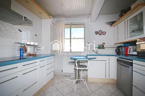 Appartement P4 de 66 m2 avec cours, garage et caves