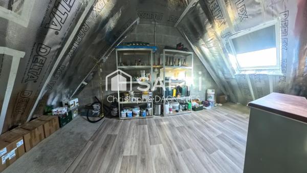 Maison familiale avec jardin paysager - 3 chambres, bureau, garage et véranda.