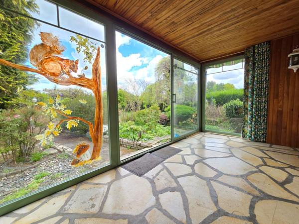 Maison T4 avec véranda au coeur d'un jardin  luxuriant