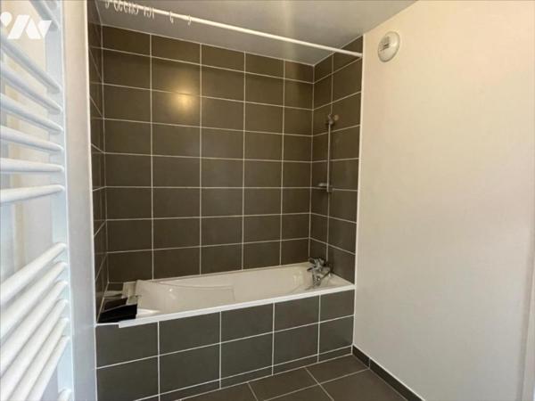BEZANNES appartement en rez-de-jardin de type deux pièces principales, 50 m² surface habitable