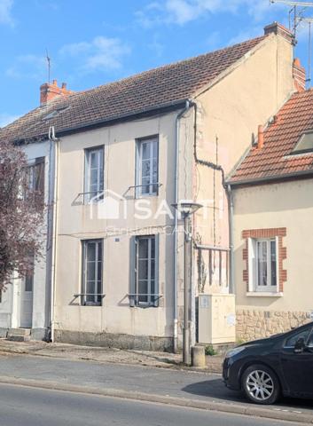 Maison composée de 2 appartements, cour, jardin.