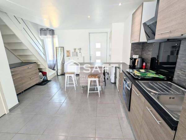 Maison composée de 2 appartements, cour, jardin.