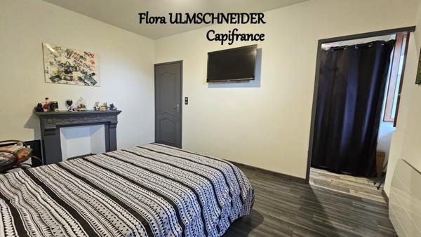 Authenticité et espace : grande maison mitoyenne en pierre avec 5 chambres à vendre à CHINDRIEUX avec garage et terrain proche du lac du Bourget