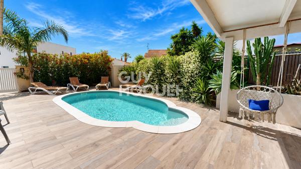 Villa constituée de trois appartements, piscine et garage.