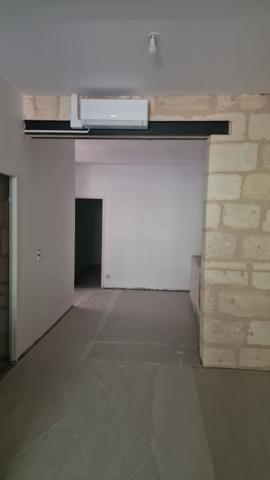 Immeuble de commerce et 2 appartements