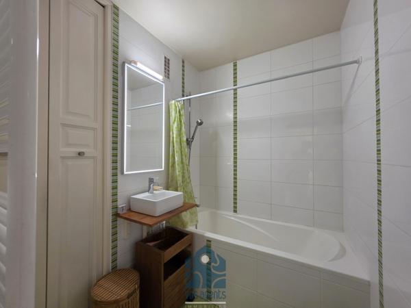 Appartement 4 pièces avec balcon, cave et stationnement couvert sécurisé