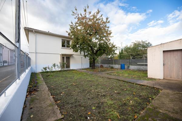 Maison jumelée de 107m2 avec 3 chambres et jardin,