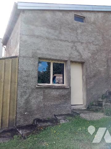 maison de rapport comprenant 3 appartements , un jardin et un garage