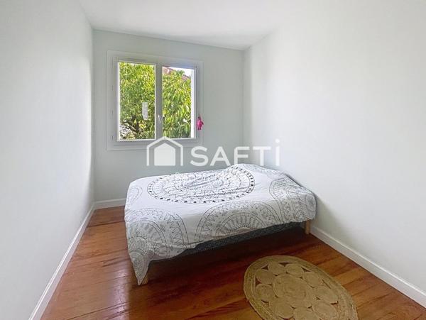 T3 avec jardin privatif, balcon, garage et parking