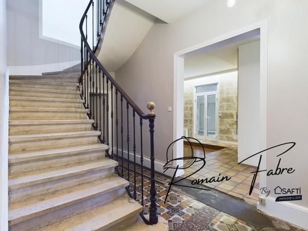 Immeuble avec Logements de 5 chambres et 2 commerces loués centre Cavignac, rentabilité importante