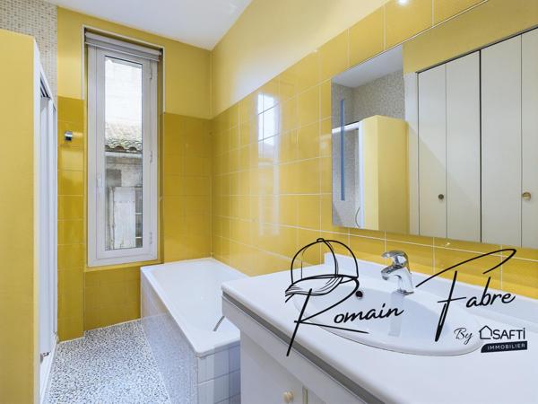 Immeuble avec Logements de 5 chambres et 2 commerces loués centre Cavignac, rentabilité importante