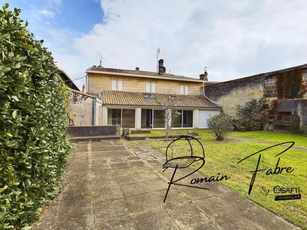 Immeuble avec Logements de 5 chambres et 2 commerces loués centre Cavignac, rentabilité importante