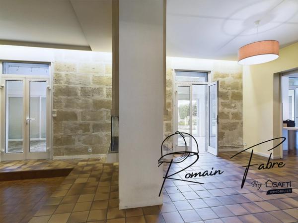 Immeuble avec Logements de 5 chambres et 2 commerces loués centre Cavignac, rentabilité importante