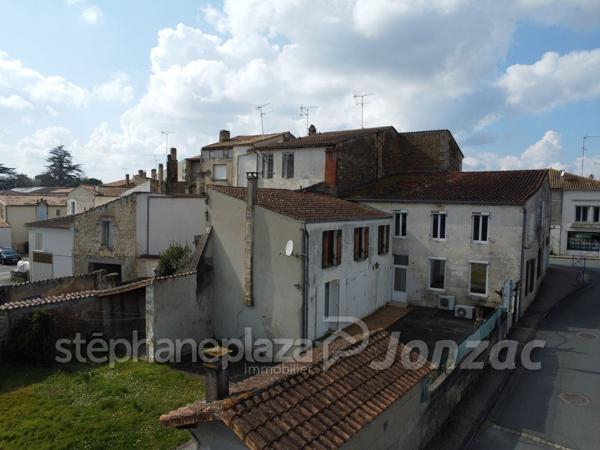 Grand Immeuble avec nombreuses possibilités