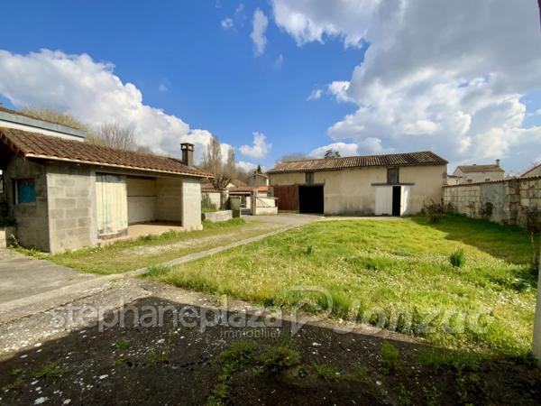 Grand Immeuble avec nombreuses possibilités