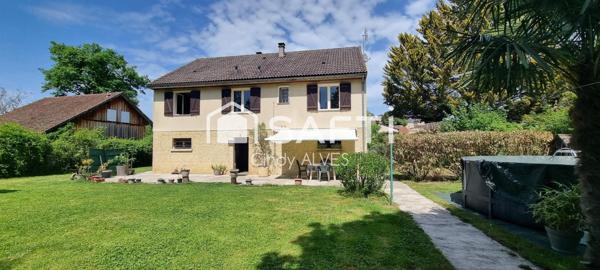 Maison 4 chambres avec sous sol et parc arboré.