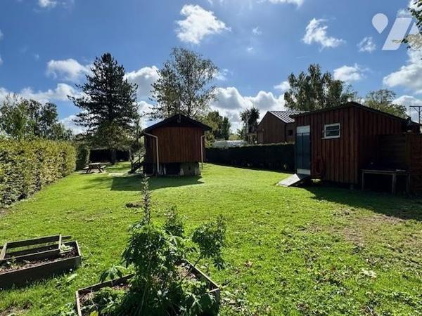 TERRAIN DE LOISIRS AVEC UN CHALET BORD DE RIVIERE