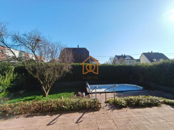 En exclusivité Jolie Maison de 150m² au sol à HOLTZHEIM avec piscine chauffée, climatisation sur 7 ares de terrain