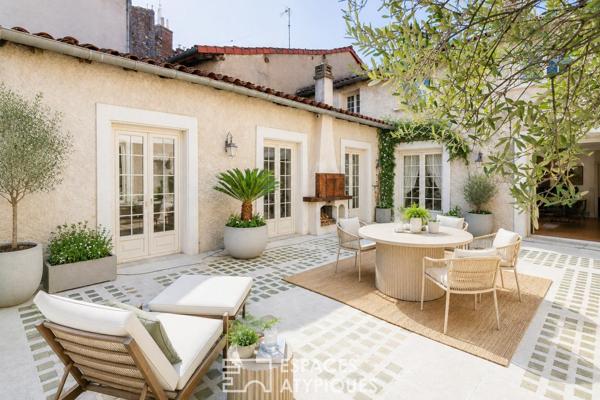 Maison de ville avec terrasse, garage et local commercial