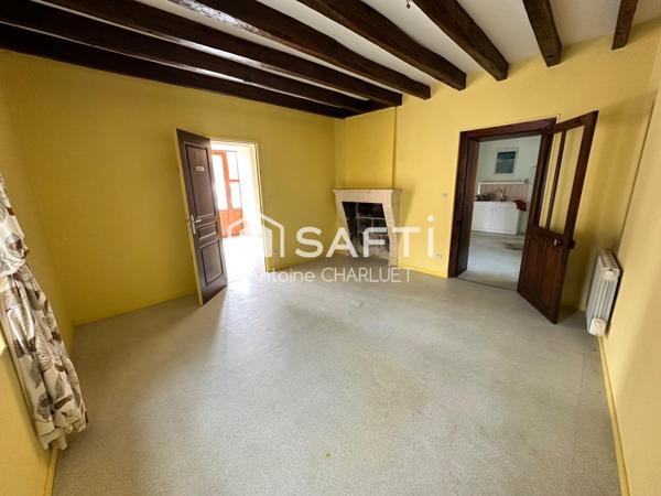 Maison avec beau potentiel locatif.