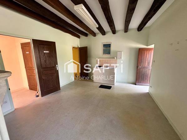 Maison avec beau potentiel locatif.