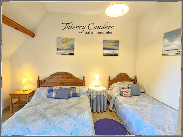 Charmant gîte de 81 m² sur terrain boisé avec piscine chauffée.