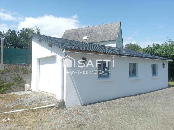 CHATEAUNEUF DU FAOU (29520), Terrain avec garage, petit atelier, parking privé, en centre bourg.