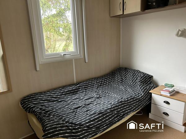 Mobil-Home, chalet et garage sur un terrain de 1115 m²