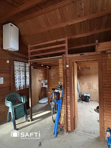 Mobil-Home, chalet et garage sur un terrain de 1115 m²