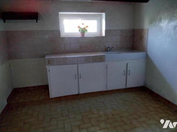 Maison d'habitation proche centre-ville avec terrain