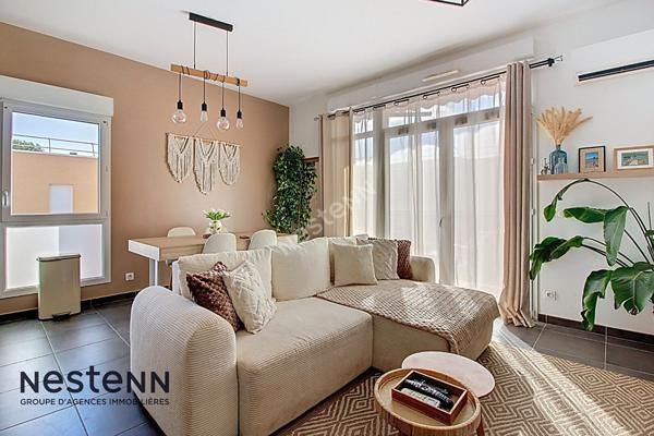 Appartement 3 pièces de 60m² avec terrasse et place de parking privative en sous sol