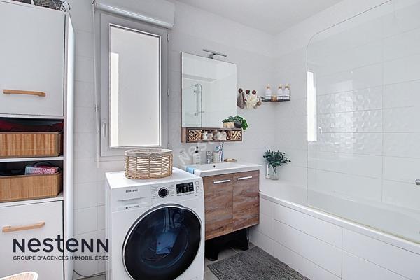 Appartement 3 pièces de 60m² avec terrasse et place de parking privative en sous sol