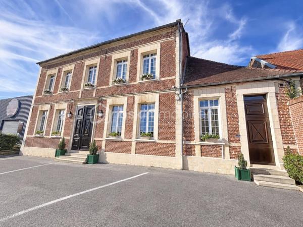 ENSEMBLE IMMOBILIER AVEC RENTABILITÉ LOCATIVE IMMÉDIATE 

Cet ensemble immobilier , composé d'une maison d'habitation de caractère  , de deux appartements loués et de boxs de stockage, vous séduira par son charme et son potentiel !

La maison d'habitation, idéale pour une famille nombreuse, a su conserver le charme de l'ancien et dispose de superbes volumes !
Au rez de chaussée, les deux halls d'entrée desservent une spacieuse cuisine aménagée et équipée donnant sur un joli jardin, une grande pièce de vie de  60 m2 , un  petit salon , une  salle à manger avec cheminée à foyer ouvert  et un  bureau.
L'espace nuit se situe au premier étage avec cinq grandes chambres parquetées, ainsi qu'une salle de bain mixte et une lingerie.
Le second étage a été aménagé en une grande salle de 80 m2 qui pourra faire office de salle de jeux ou salle de réception.

Cet ensemble vous offre une RENTABILITE LOCATIVE IMMEDIATE de  33 000 euros / an grâce à un bâtiment composé de  35 boxs de stockage et deux appartements ( un T2 et un T1) , tous dejà  loués, 
Vous pourrez également aménager des boxs supplémentaires.

L'extérieur se compose d'une grande cour en macadam et d'un jardin  de + 1000 m2 , totalement clôturé.

Cet ensemble dispose de prestations qualitatives ( chauffage au gaz de ville, menuiseries PVC double vitrage, adoucisseur ...) et vous permettra de bénéficier des  commodités de la commune ( commerces, école, collège ....) à proximité.

À seulement 1h30 en train de Paris, 20 mins de Saint Quentin et 40 mins de Cambrai, ce bien est une vraie opportunité pour un  projet de vie durable .

CONTACTEZ MOI POUR UNE VISITE !