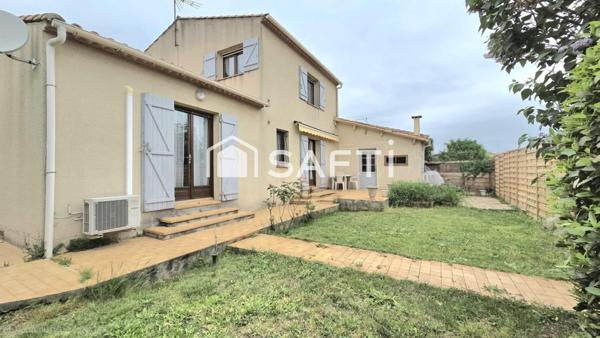 Maison de 125 m2, 4 chambres, 2 salles de bain, jardin et garage.