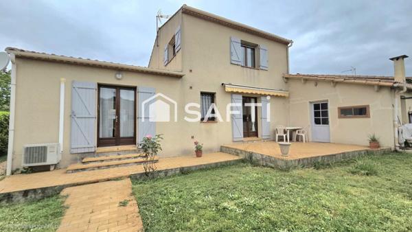 Maison de 125 m2, 4 chambres, 2 salles de bain, jardin et garage.